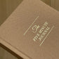 Brown journal with 'The Five Minute Journal' embossed on it