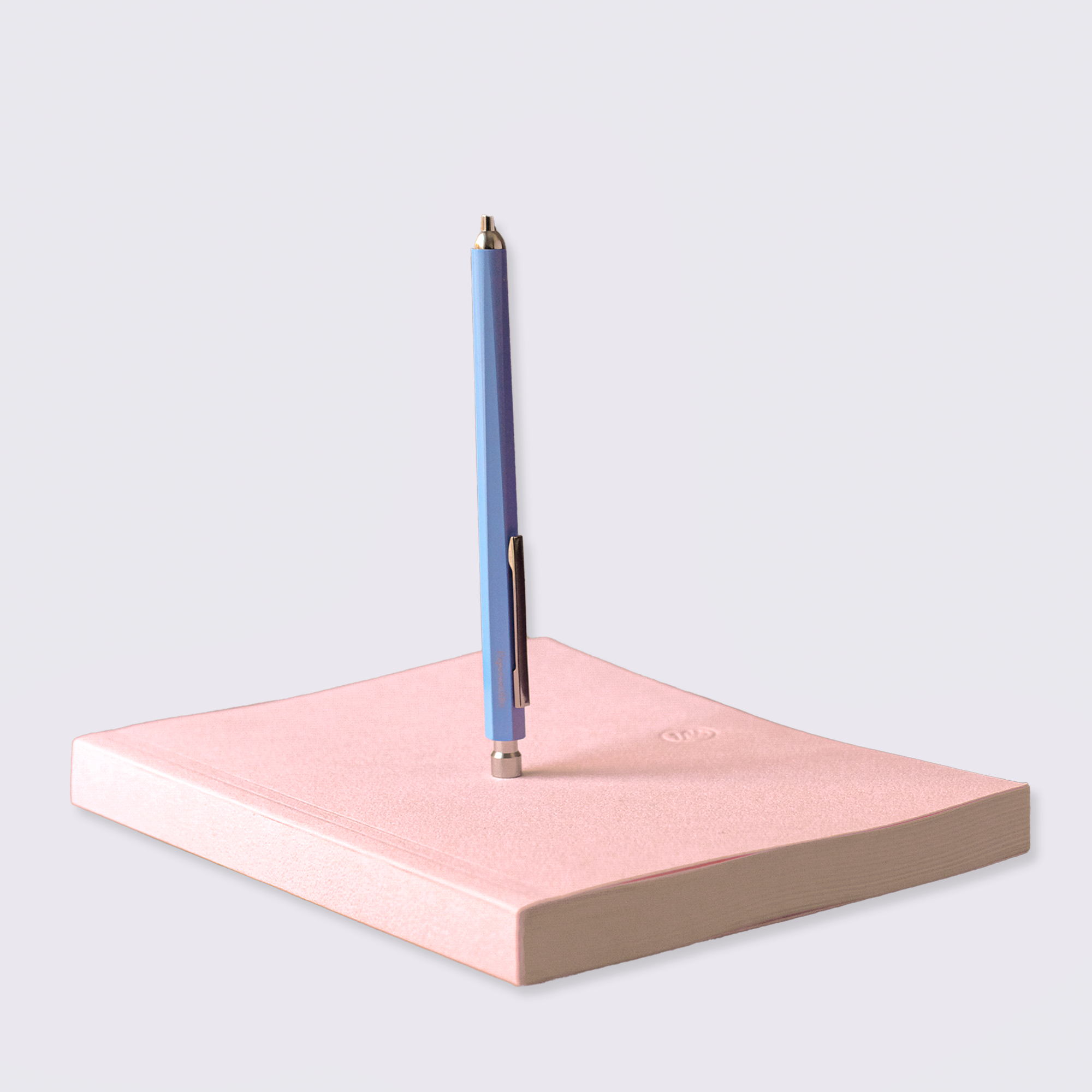 pink notebook and pen set