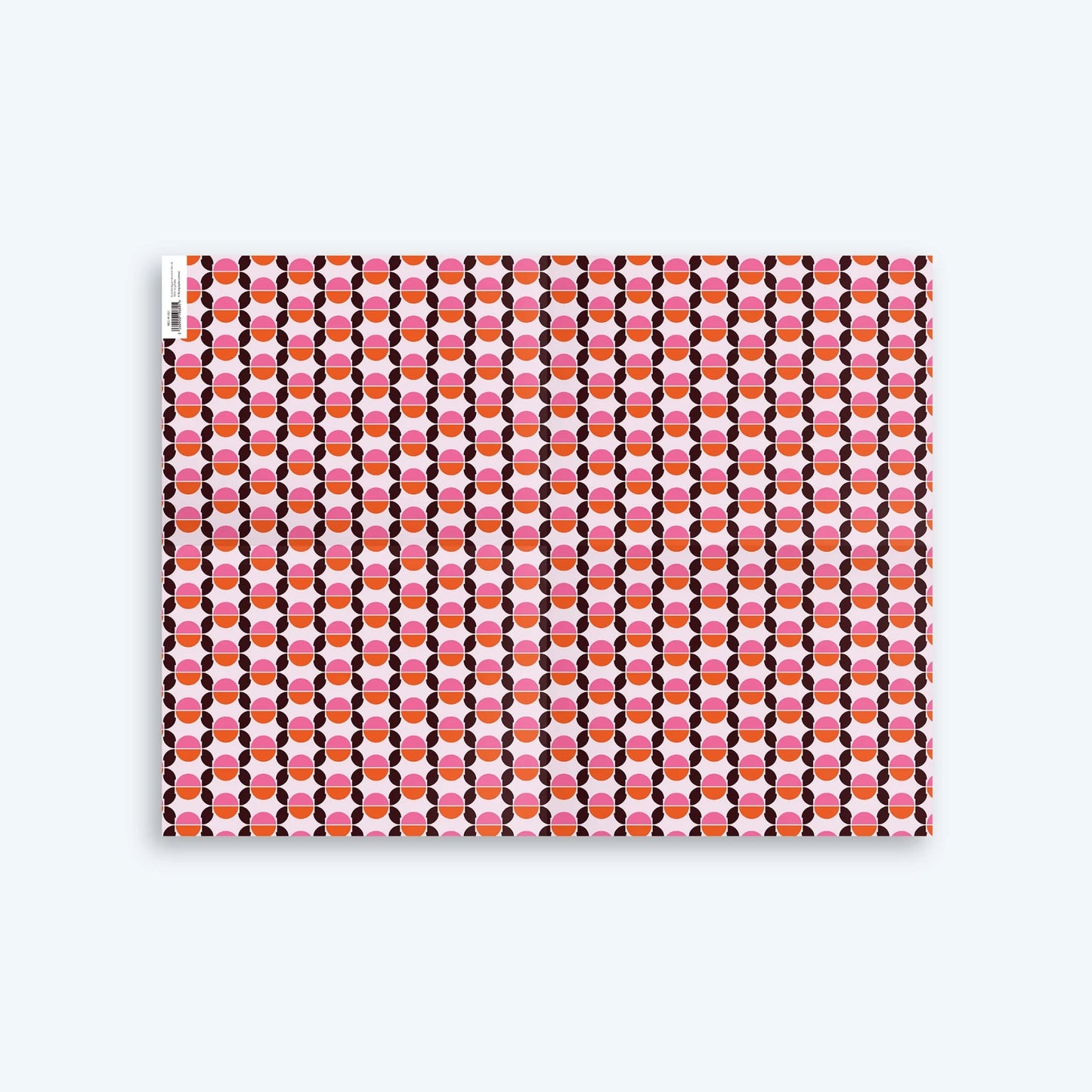 Seventies Wrapping Paper with geometric circular design and retro pink, orange and brown colours. 
