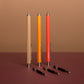 Set of colorful pens on a brown surface with a brown background