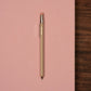 Beige pocket pencil on pink notebook