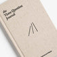 Close up of the the Three Question Journal in Oat. A prompted for journal writing with a linen cover. 