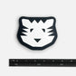 Black and white tiger face design on a white background with a ruler for scale.