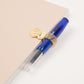 Clip Attaching Pen to Notebook